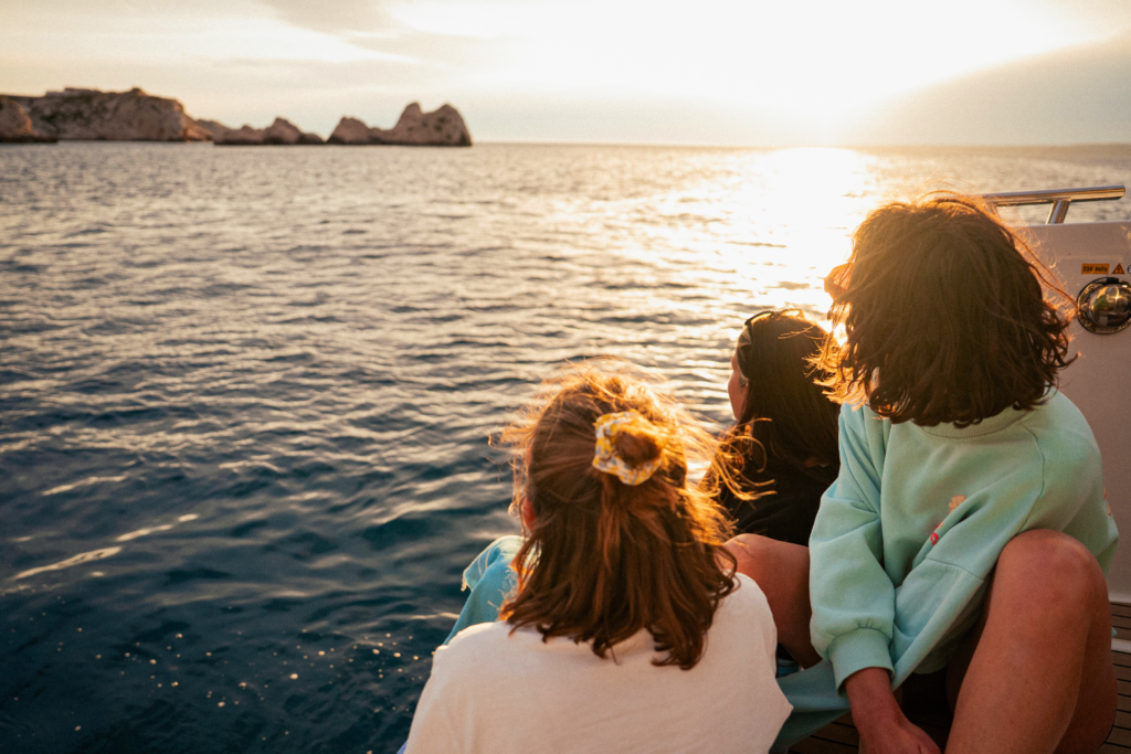 People watching the sunset from a boat